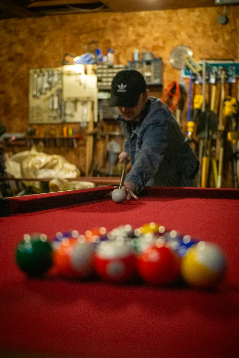 Player lining up a break at a pool table